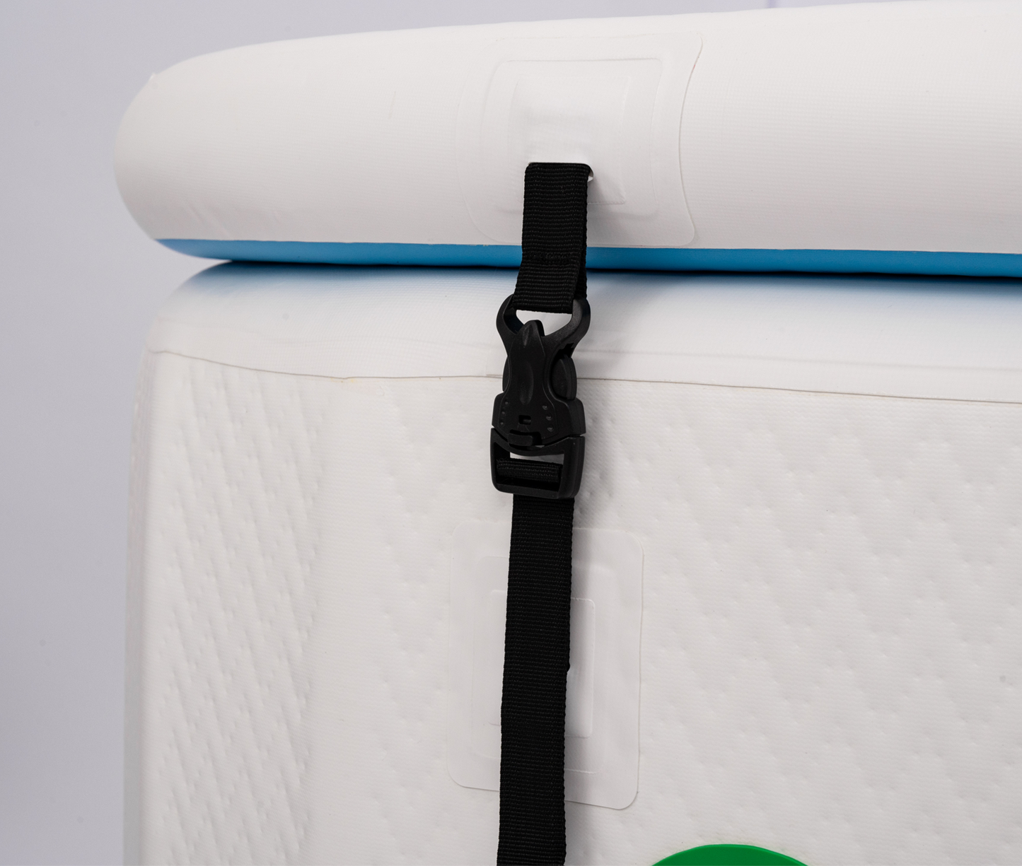 Close-up of a black strap securing a RevX Inflatable Cold Plunge Tub Deluxe