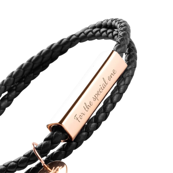 Black leather layered bracelet worn on wrist. Rose Gold